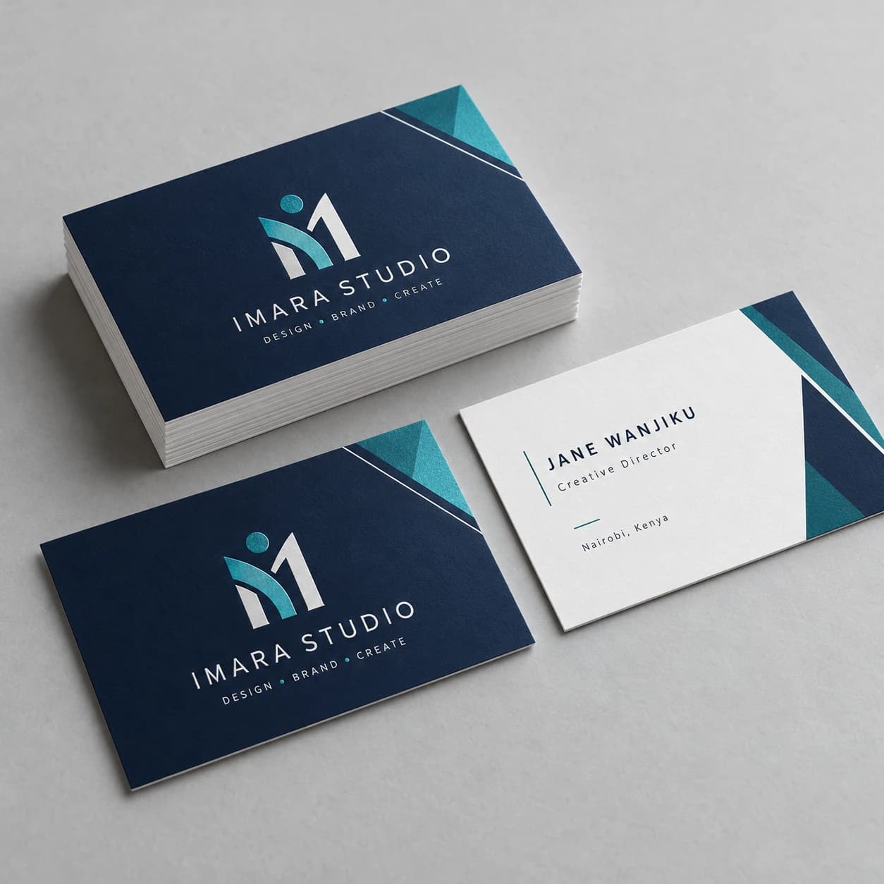 Professional business card design mockup featuring navy, teal and white layouts with matching front and reverse designs.