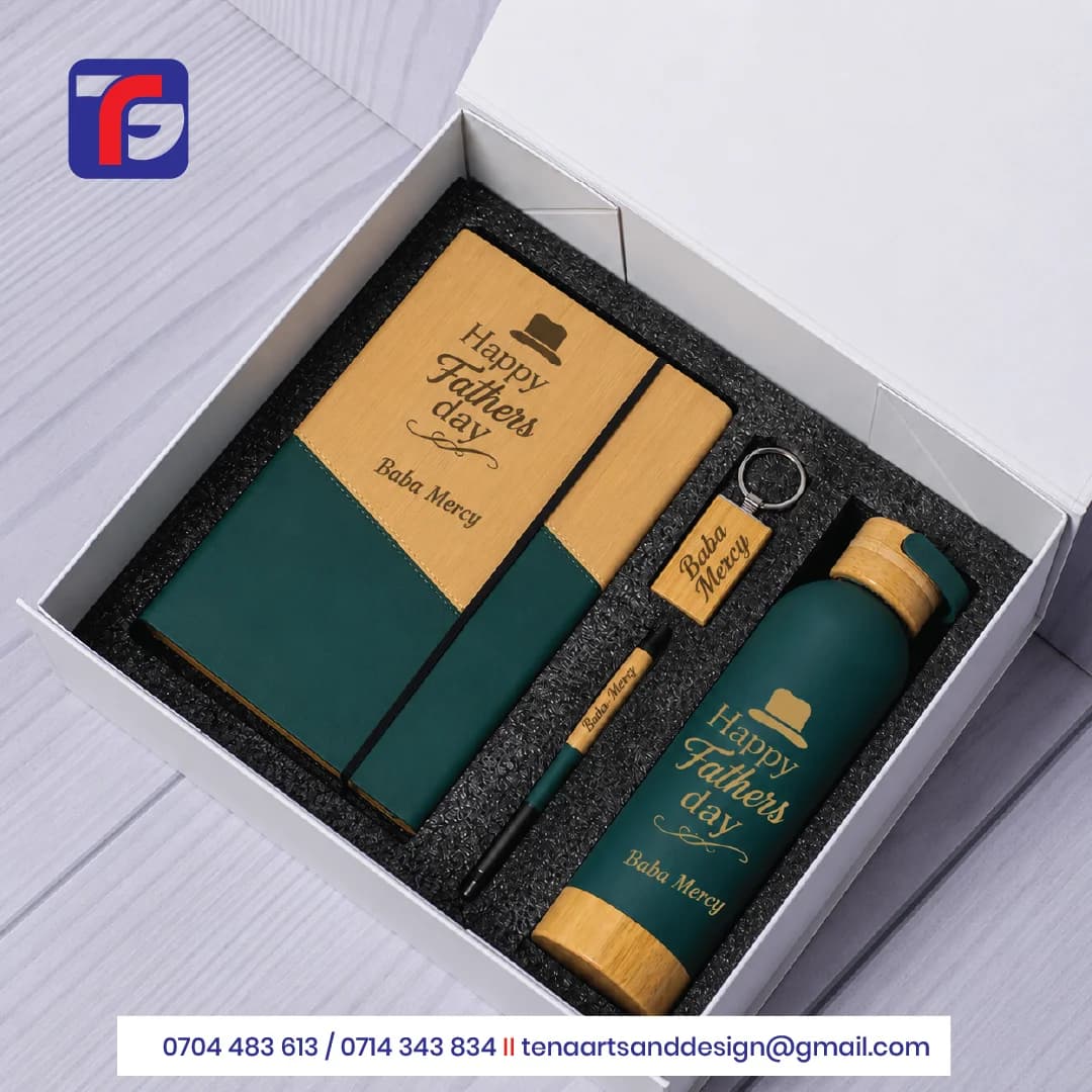 Green and wood-look Father’s Day gift set with a notebook, bottle, pen and keyring personalised for Baba Mercy.