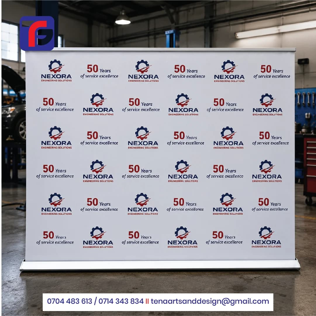 White tradeshow banner with repeated Nexora logos and 50 Years of service excellence wording, a silver top rail and broad floor base.