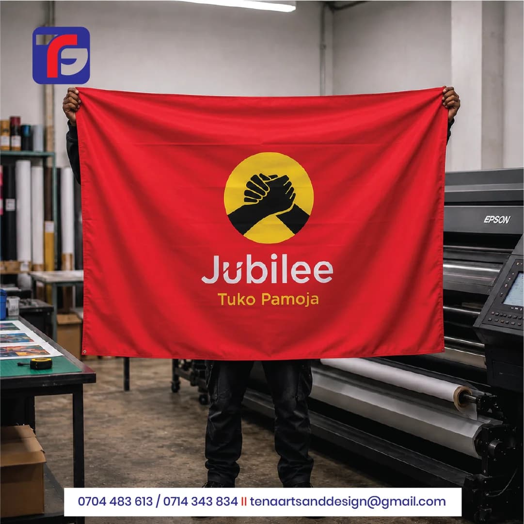 Red Jubilee campaign flag with a black clasped-hands emblem in a yellow circle, white Jubilee lettering and yellow Tuko Pamoja wording.