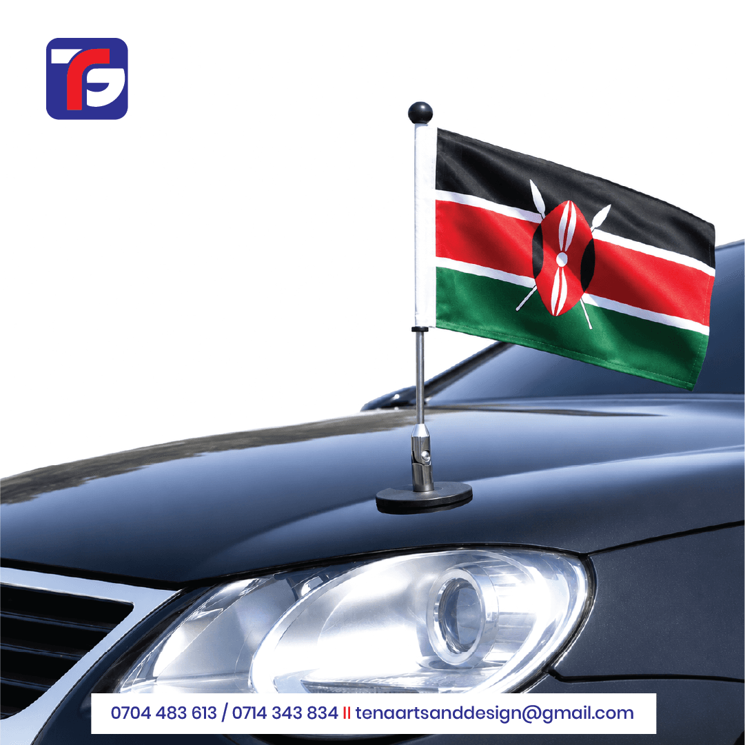 Kenyan flag on a silver-coloured pole with a black ball finial and round base resting on a dark car bonnet.