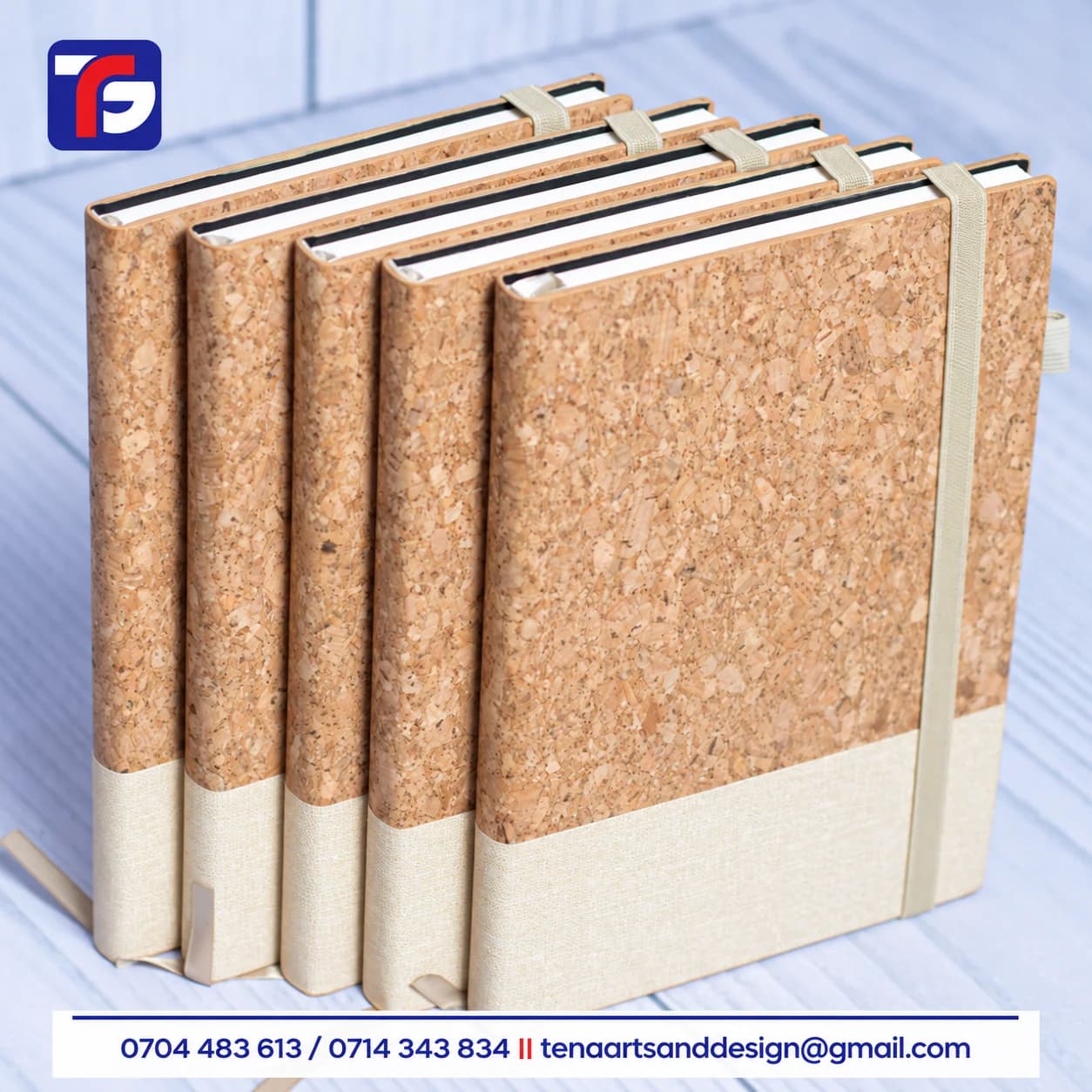 Cork and fabric executive notebooks with natural brown upper covers, beige lower panels, elastic closure bands and pen loops