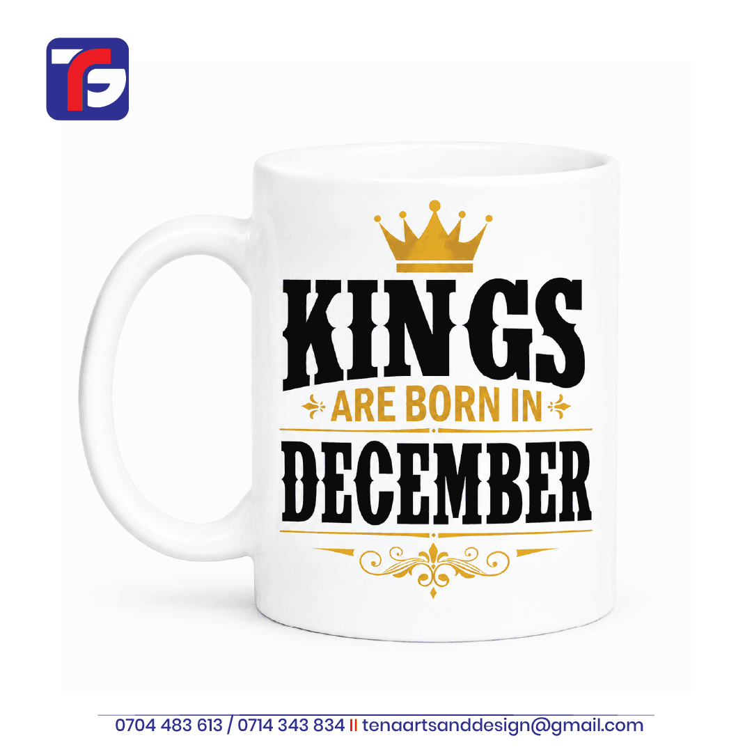 December birthday mug Kenya in white with black Kings Are Born in December lettering, a gold-toned crown and decorative flourishes.