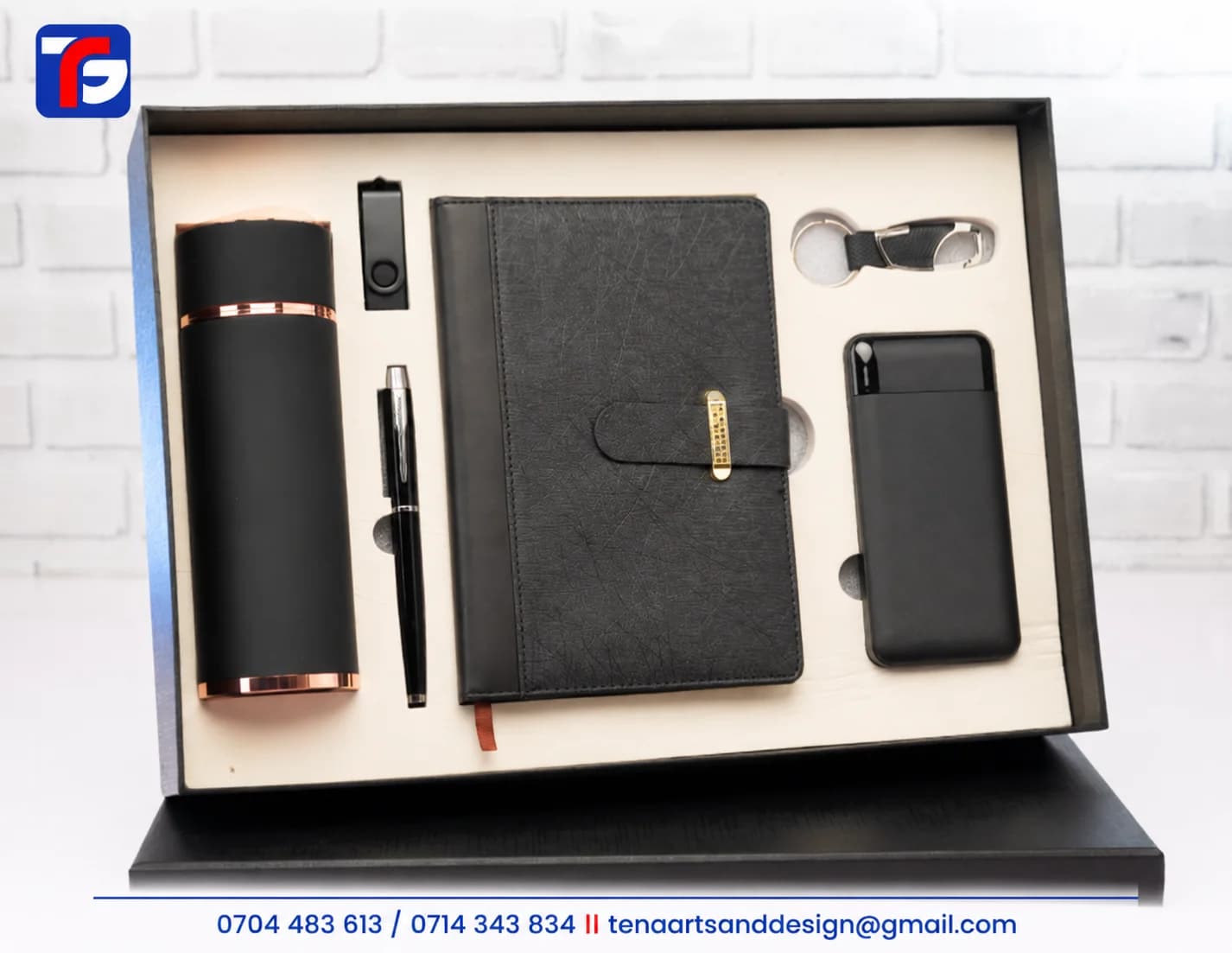 Black flask and power bank gift set with a notebook, pen, flash disk and metal keyholder in a presentation box