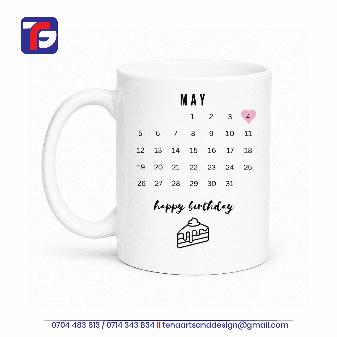 May birthday calendar mug in white with a pink heart highlighting 4 May, happy birthday lettering and a cake slice illustration.