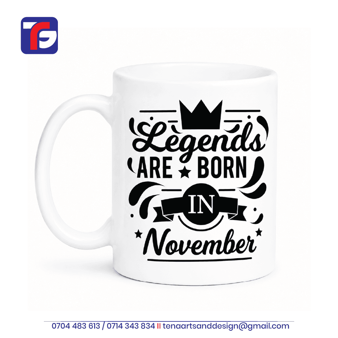 November birthday mug Kenya in white with black Legends Are Born in November artwork, a crown, stars and ribbon motif.