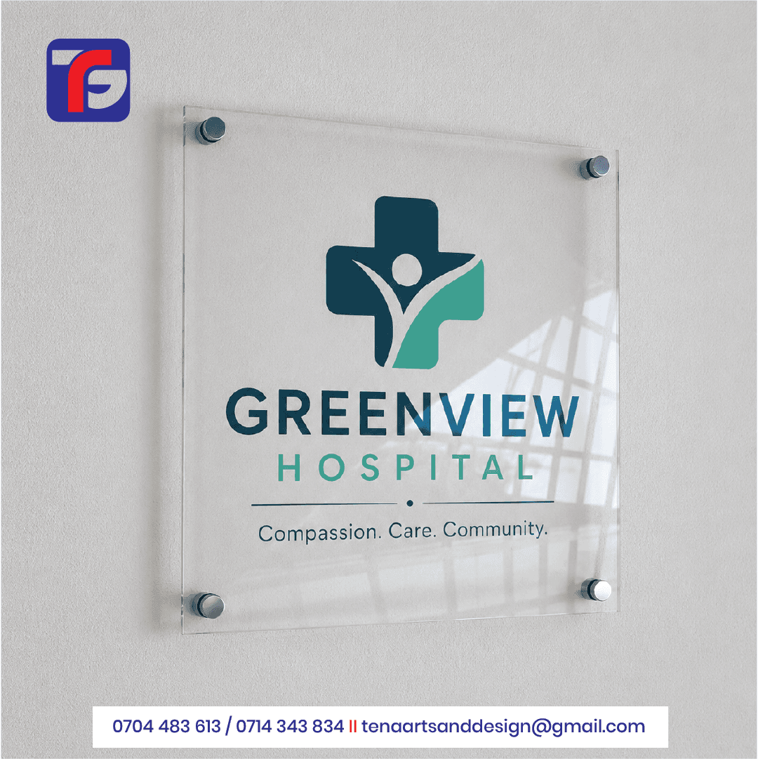 Clear acrylic reception sign displaying the Greenview Hospital logo and tagline, wall-mounted with four metal standoff fittings