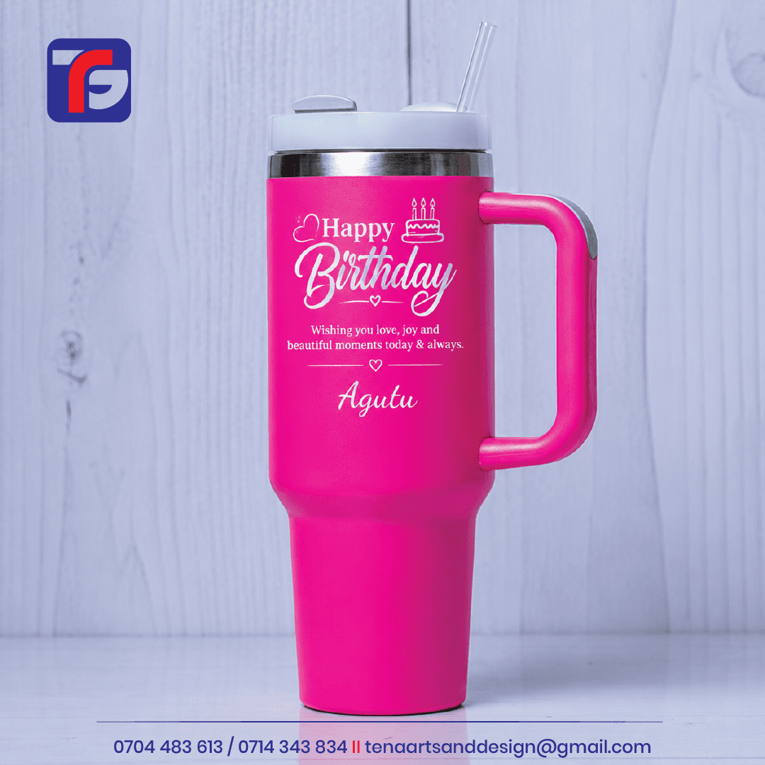 Personalised birthday tumbler Kenya in pink with a handle, lid, clear straw and Happy Birthday artwork personalised with Agutu.