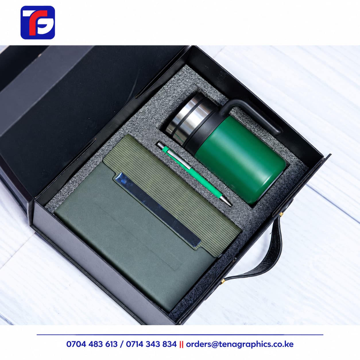 Green tea mug corporate gift set with an olive-green notebook, green handled mug and pen in a black box